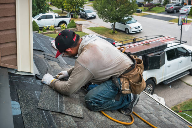 Professional Roofing technician working in Versailles, CT